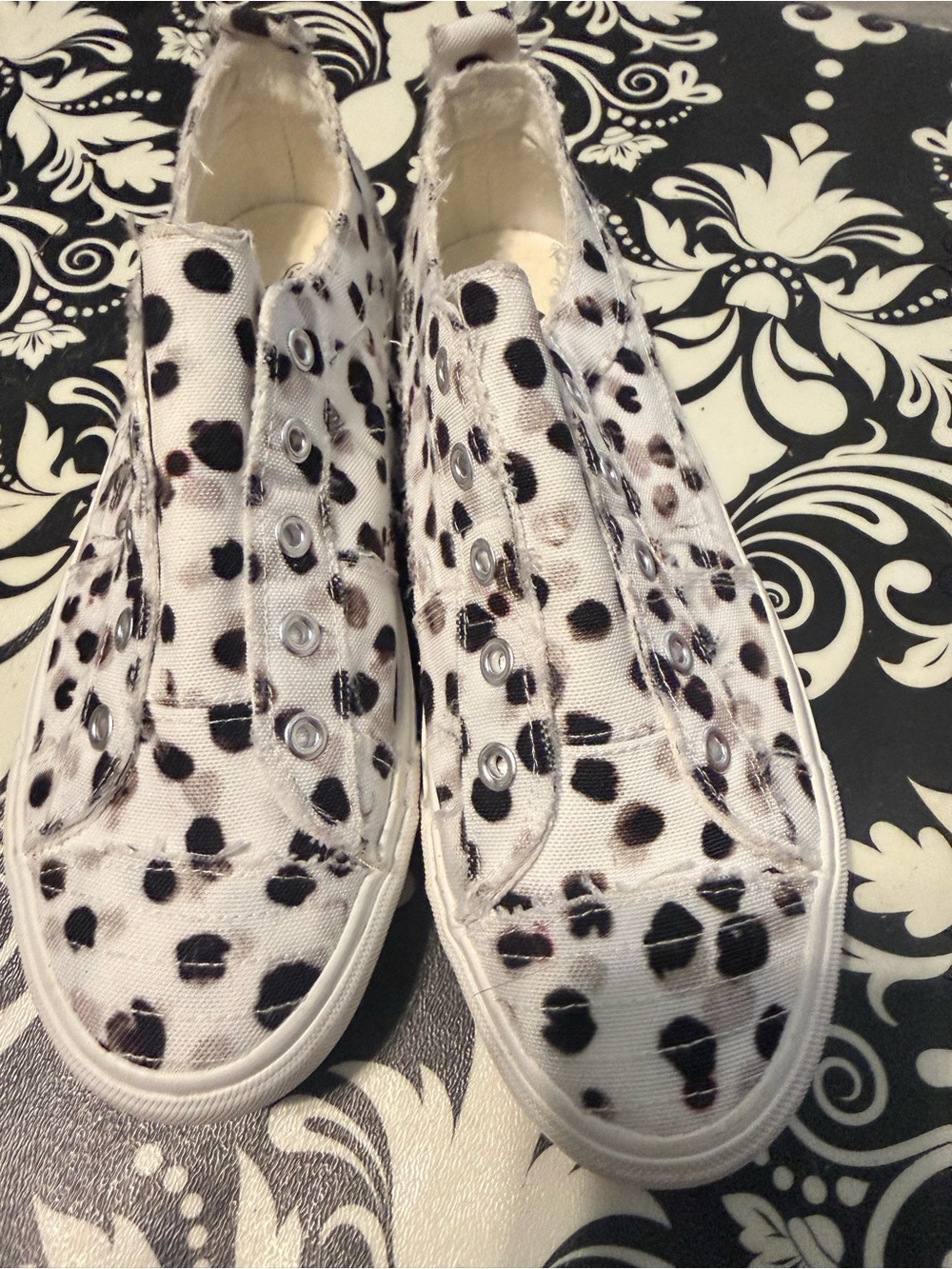 Corkys White Slip-On Canvas Sneakers with Black Leopard Spots